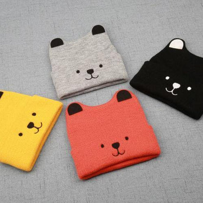 Front view of a charming knitted bear cub hat, an essential cute winter hat for kids.