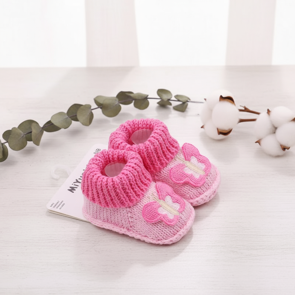 Knitted infant shoes with an adorable animal print, providing warmth and non-slip protection.