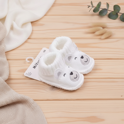 Durable knitted non-slip baby booties, offering both style and safety for little feet.
