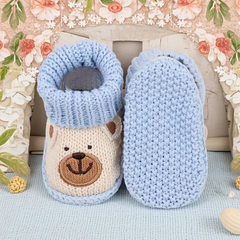 Soft sole knitted baby booties with non-slip grip, ideal for a baby's first steps.