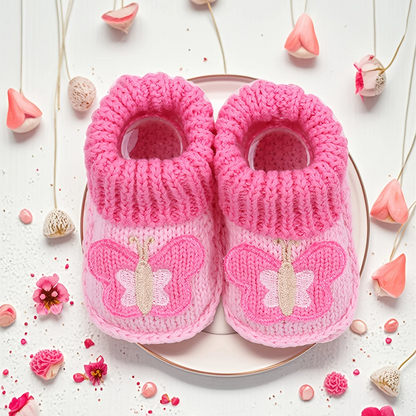 Unisex knitted baby booties, ensuring warm feet and stability for little ones.
