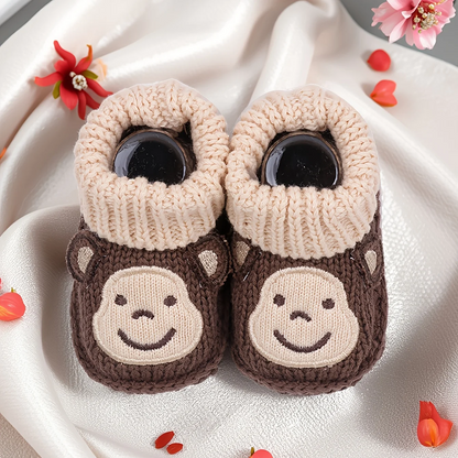 Cute animal print non-slip baby booties, a stylish and practical choice for infants.