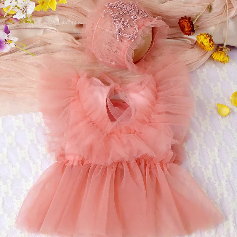 Cute baby girl's pink floral lace mesh romper and matching headband set, comfortable for infants.