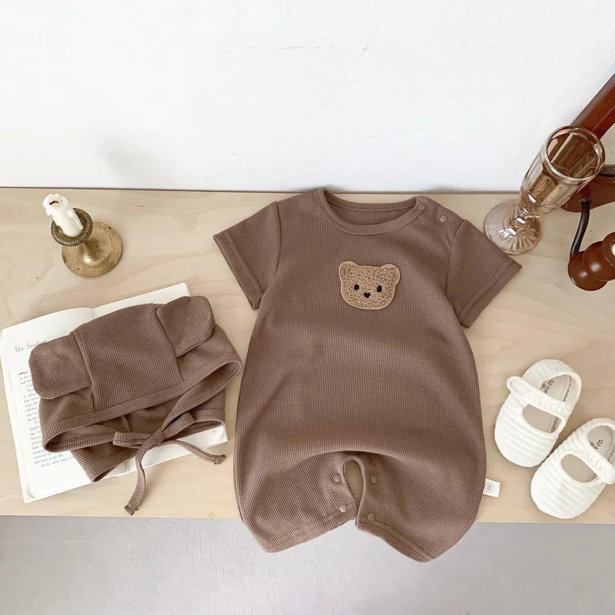 Stylish newborn bear romper in a gender-neutral color, great baby gift idea.