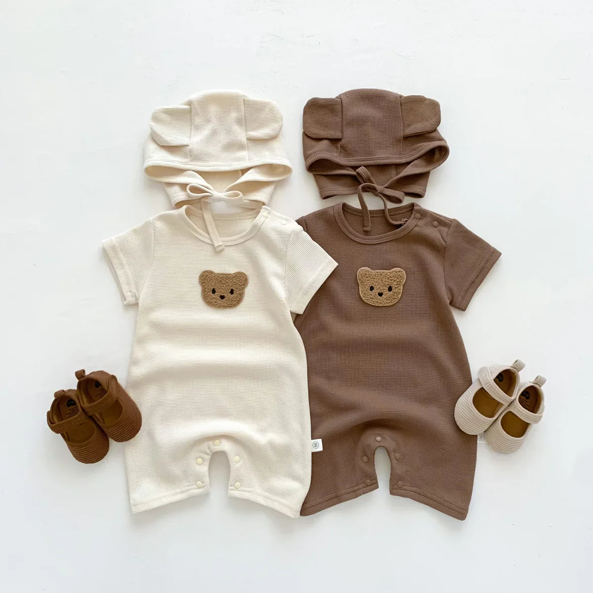 Side view of an infant wearing the delightful bear cotton romper, baby fashion.