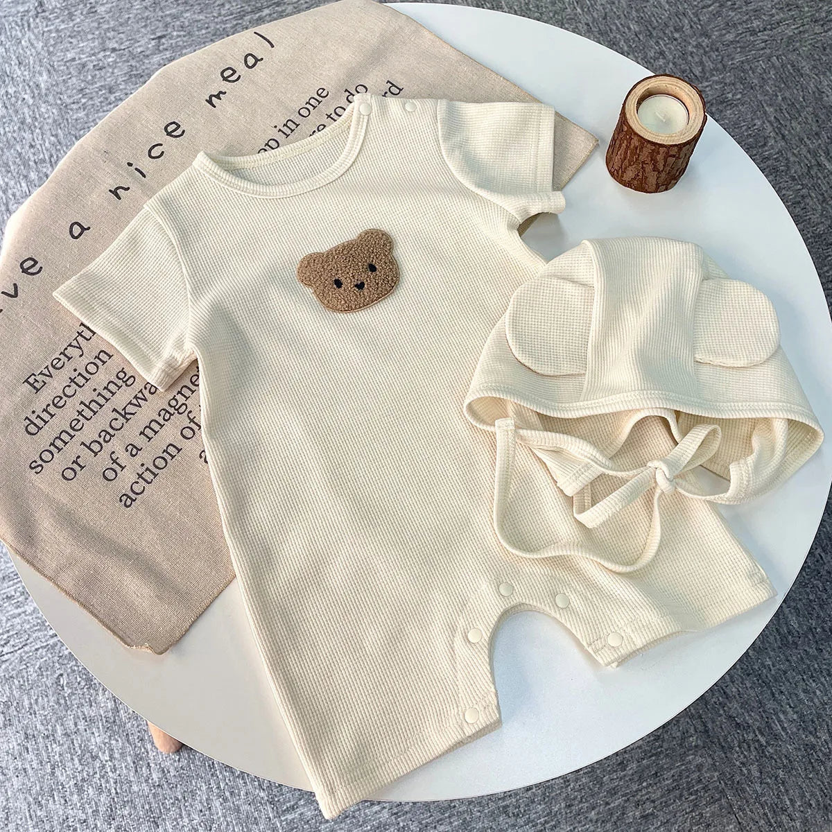 Back view of the adorable newborn bear romper, highlighting its comfortable fit.
