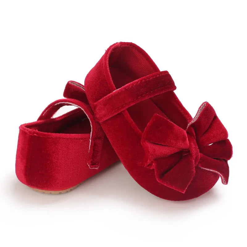 Stylish purple baby girl flat shoes with bow detail, soft sole, perfect for first steps