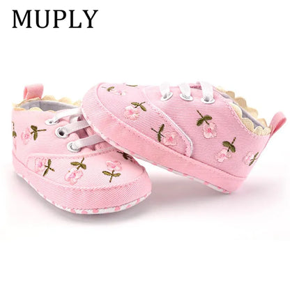 Pair of pink lace floral first walker shoes for baby girls, displayed neatly, ready for little feet.