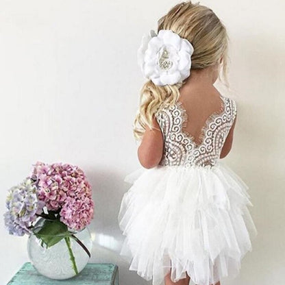 Model wearing a sparkling backless princess ruffle tutu dress, highlighting its party-ready appeal.