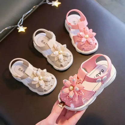 Side view of comfortable beige bow sandals for toddlers, easy to fasten.