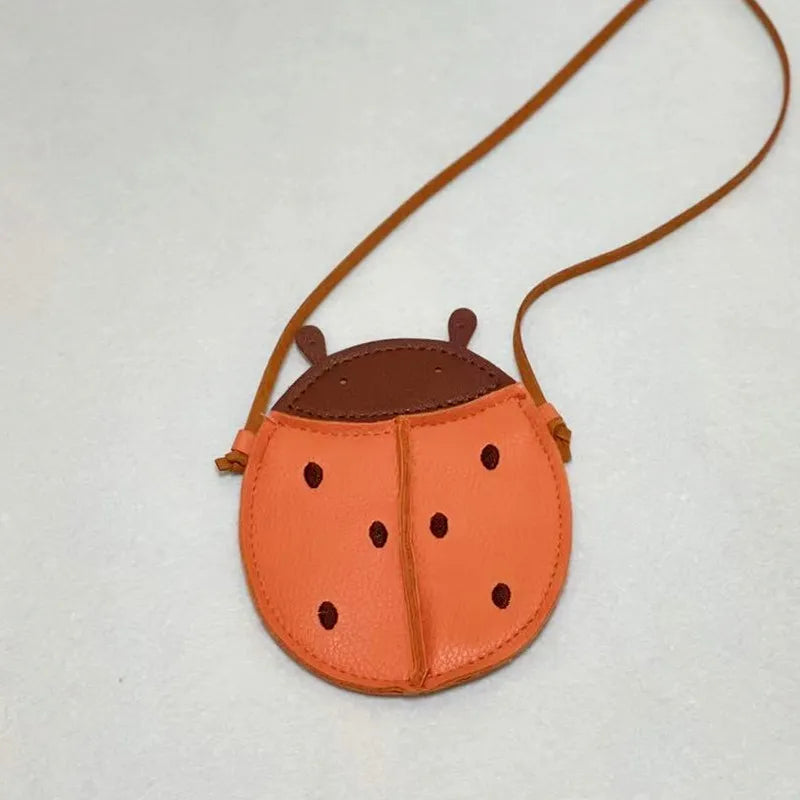 Cute green cartoon frog mini bag, highlighting its waterproof PU leather material for kids