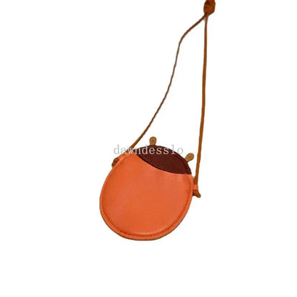 Playful green cartoon frog crossbody bag for toddlers, durable mini handbag