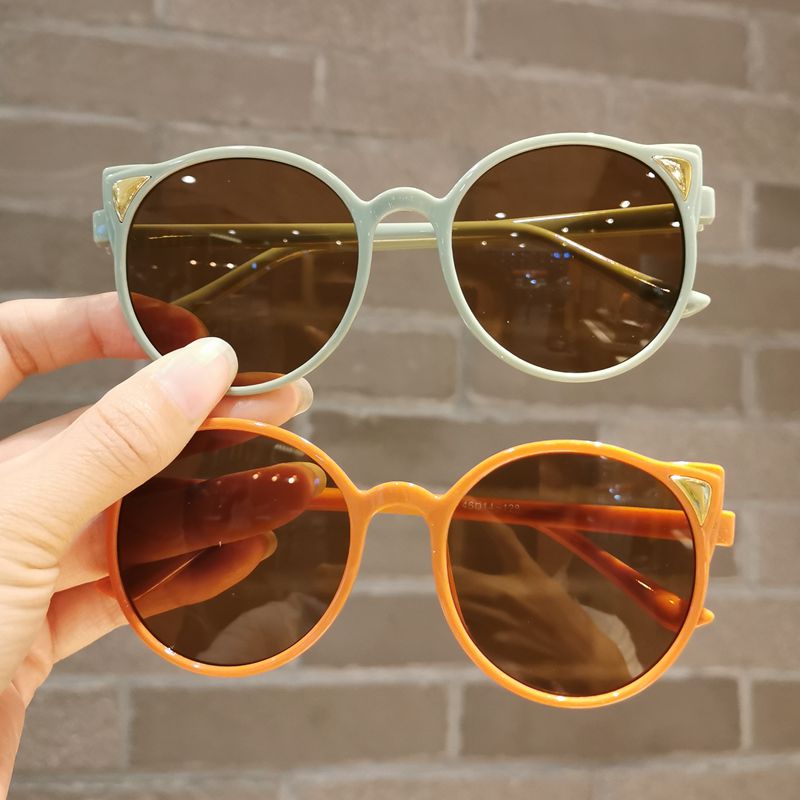 Purple cartoon cat eye sunglasses with a playful design, UV protection for children, stylish eyewear