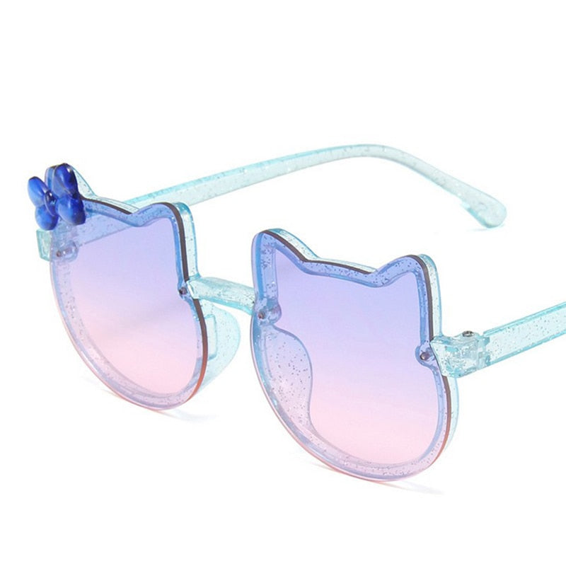Playful green cat-eye baby sunglasses, ensuring UV protection for little ones, great outdoor gear.