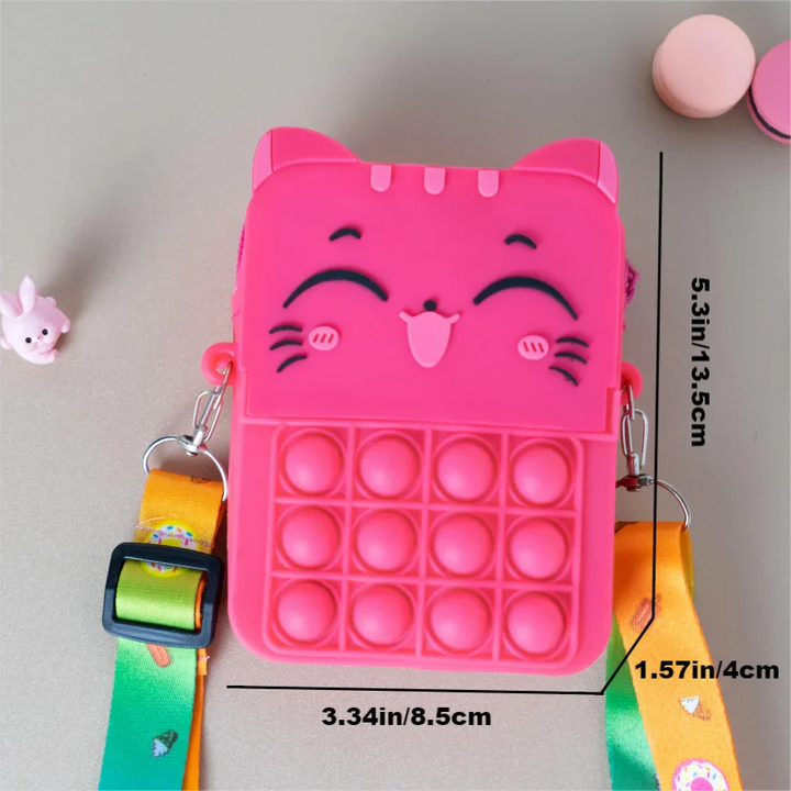 Orange cat silicone coin purse on a patterned background, vibrant kids' product.