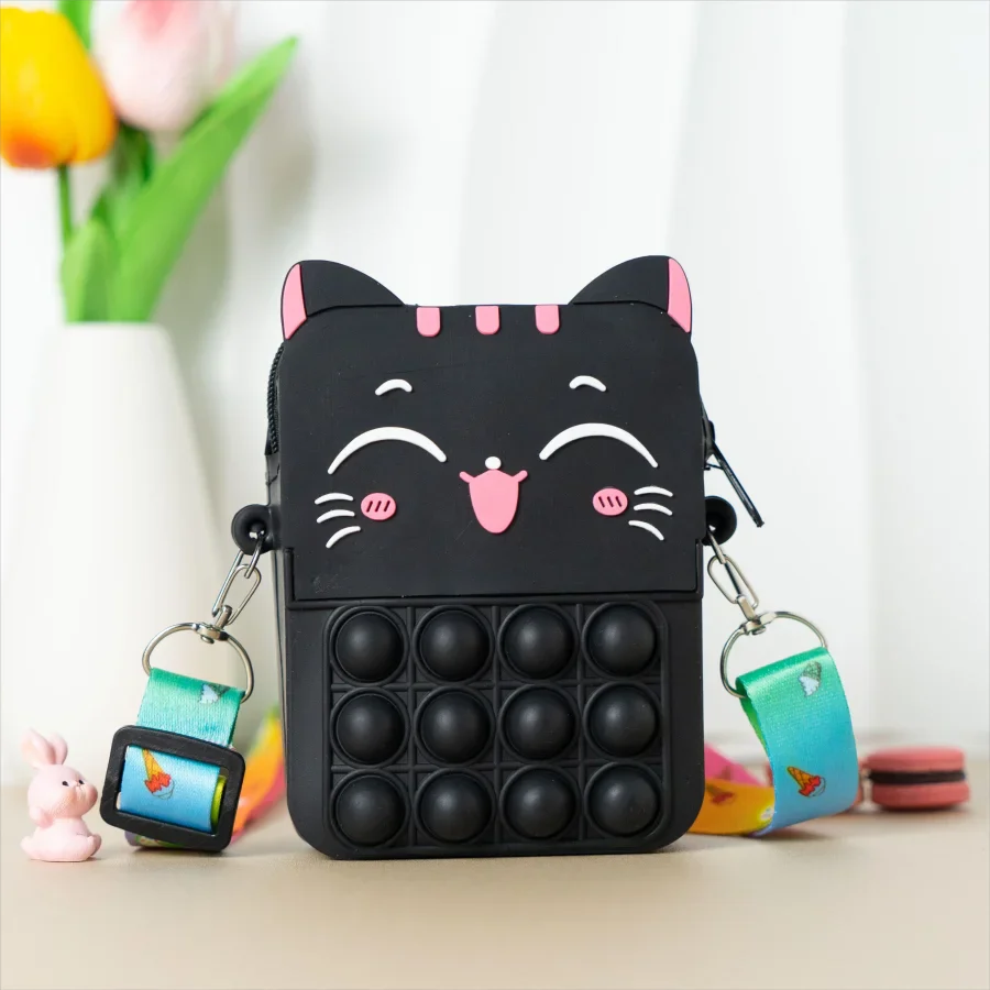 Close-up of a pink cat silicone messenger coin purse, showcasing texture and detail.