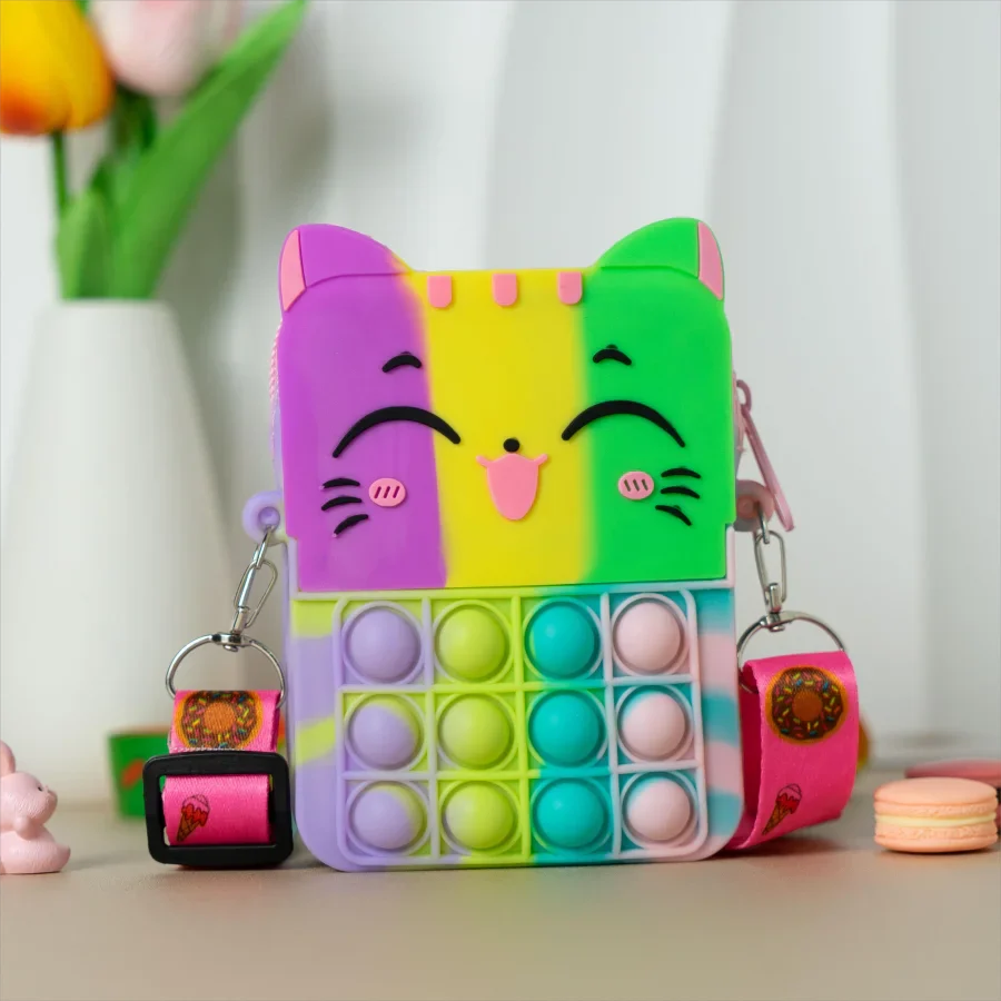 Group of colorful cat silicone messenger coin purses, vibrant kids' accessories.