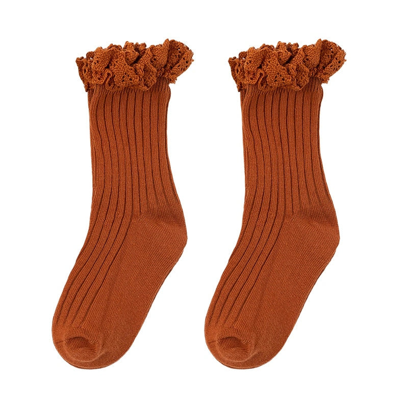 Cute yellow cotton ruffle mid-calf socks, ideal for toddlers' winter and everyday wear.