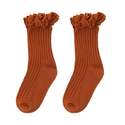 Cute yellow cotton ruffle mid-calf socks, ideal for toddlers' winter and everyday wear.