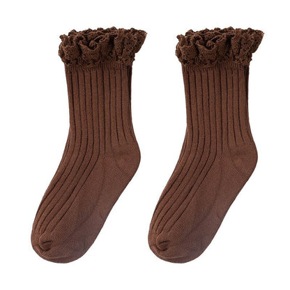 Close-up of a pink cotton ruffle mid-calf sock, highlighting the detailed ruffle and soft texture.