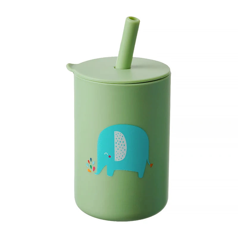 Child taking a sip from a yellow lion cartoon straw cup, promoting independent drinking