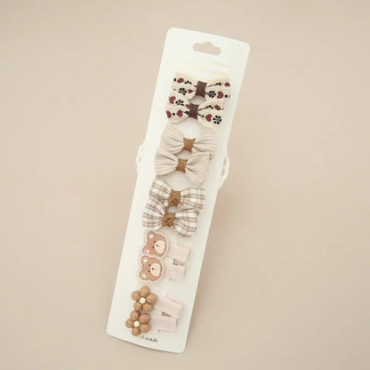 Sweet floral fabric hair bow and clip, a charming addition for young girls' delicate hair.