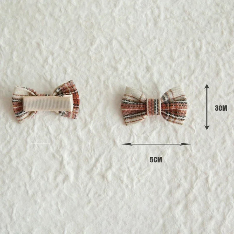 Sweet lavender fabric hair bow on a gentle clip, ideal for baby hair bows and toddler accessories.