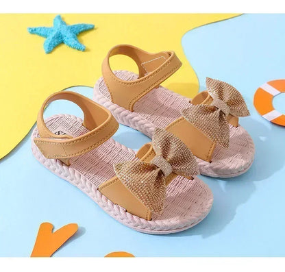 Yellow girls' bow sandals with arch support, ideal non-slip footwear for playground