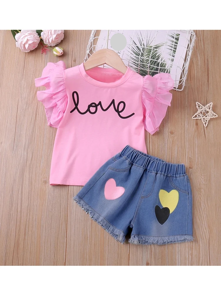 Adorable pink girls' summer fashion set with butterfly sleeves & shorts for toddlers, perfect playwear.