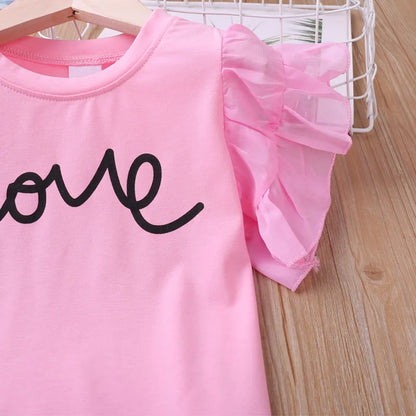 Toddler girl's pink summer set with charming butterfly sleeves and shorts, a sweet kidsclothing ensemble.