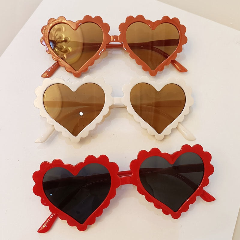 Girl's trendy heart sunglasses in a vibrant green, perfect for sunny adventures and fashion