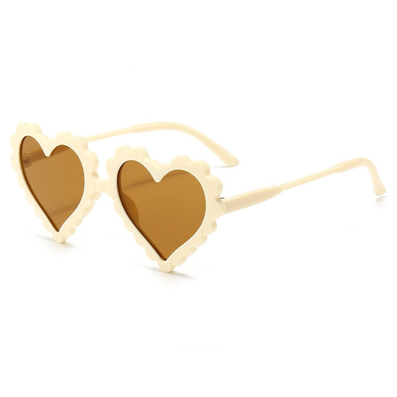 Trendy heart sunglasses for kids in red, perfect fashion accessory for toddlers, side view