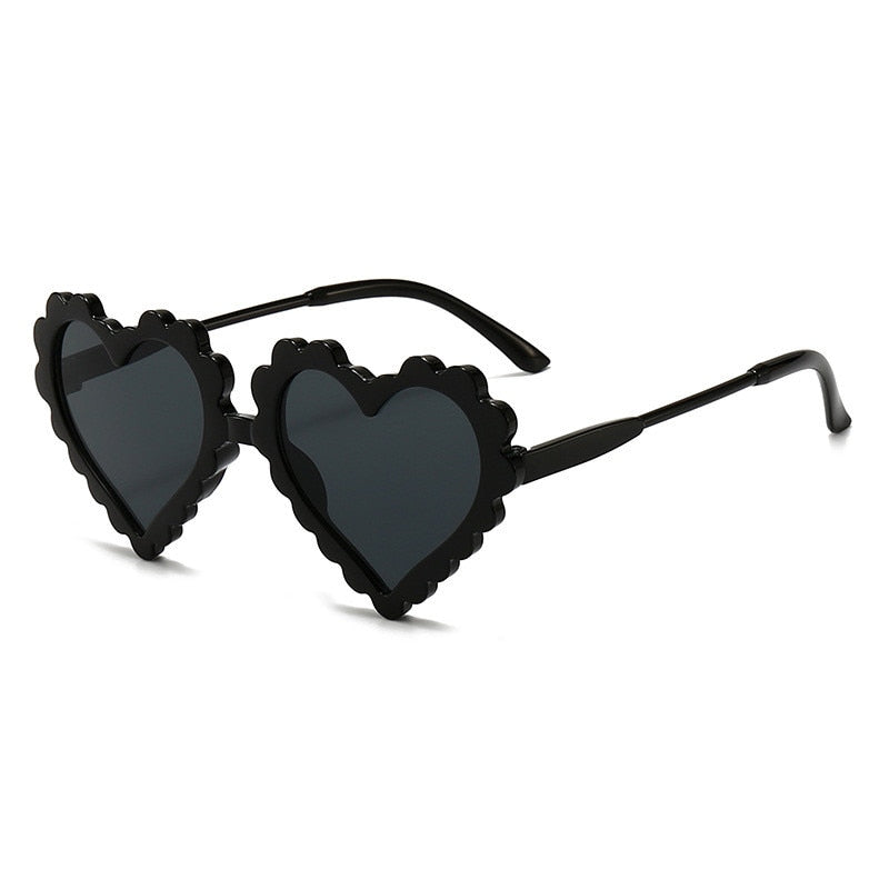 Purple heart sunglasses for girls with UV protective lenses, ideal for outdoor wear