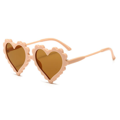 Sparkly pink heart-shaped kids eyewear, a fun and protective accessory for sunny days