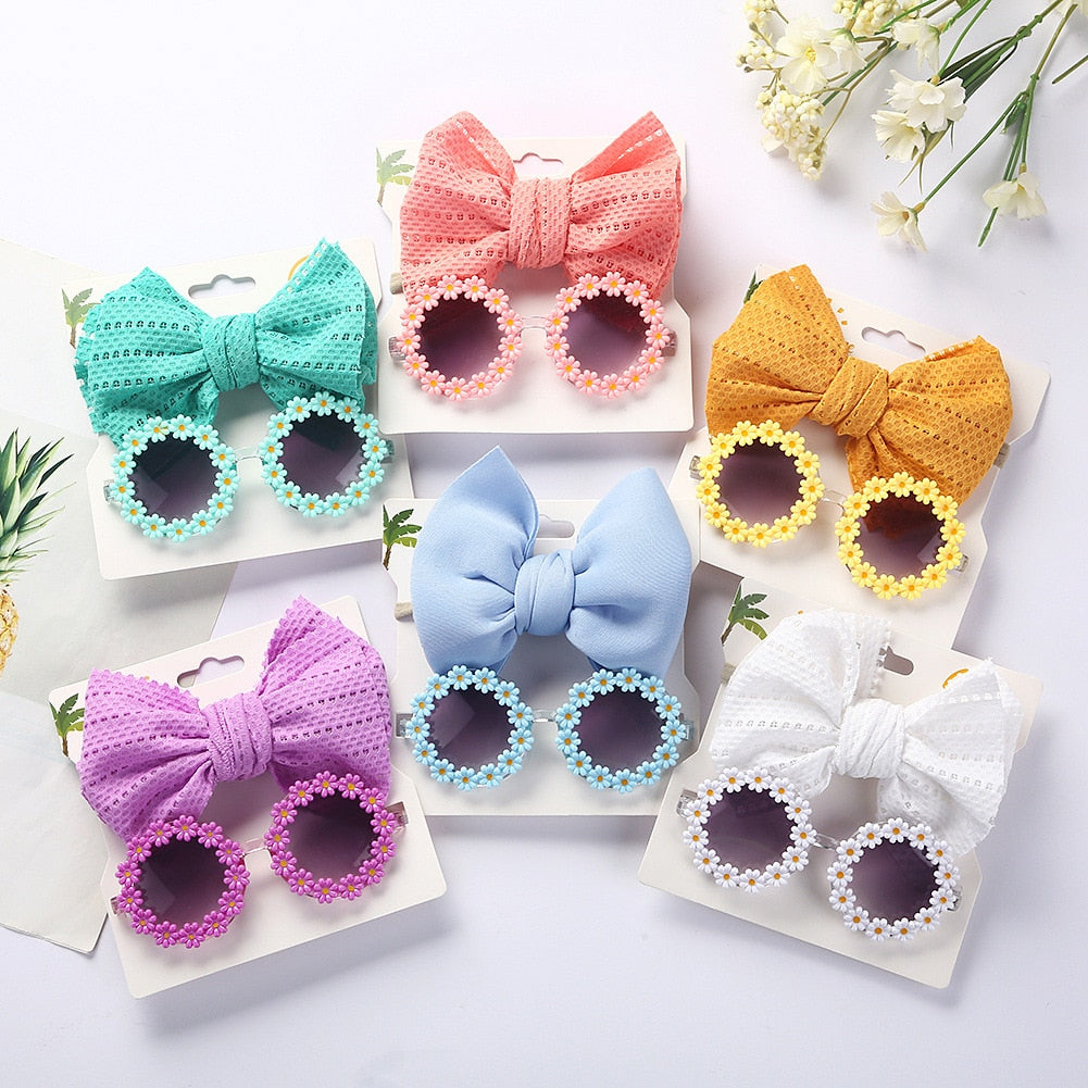 Adorable pink kids' sunglasses with bow headband, UV protection for toddler girls' fashion.