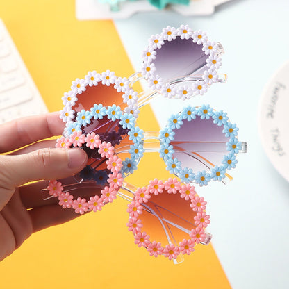 Variety of colorful kids' UV protection sunglasses with bow headbands for baby accessories.