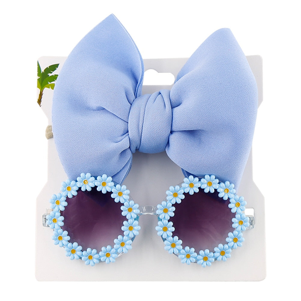 Kid's trendy purple sunglasses and matching bow headband, essential UV protection eyewear.