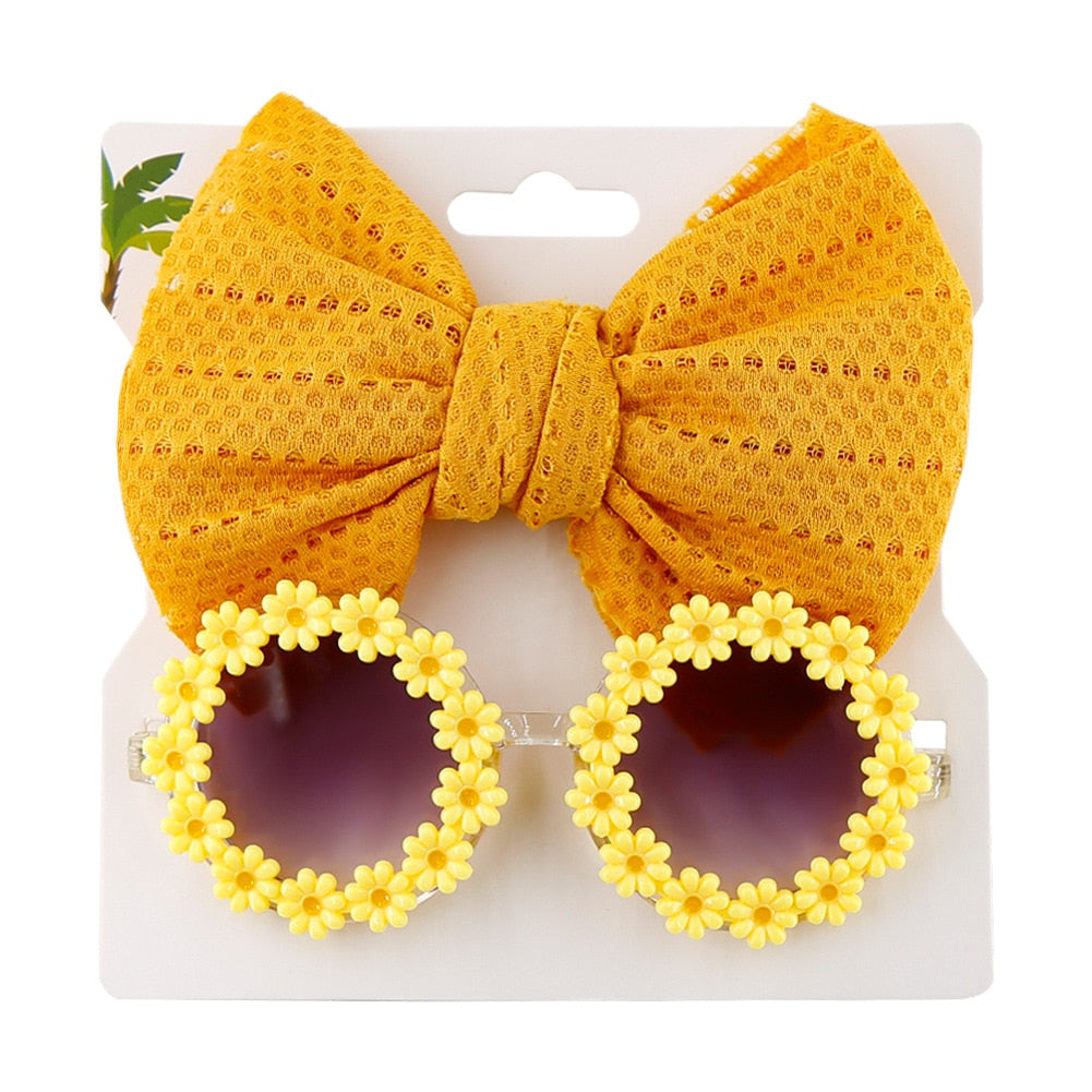 Cute yellow children's sunglasses with a bow headband, durable sun protection baby accessory.