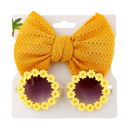 Cute yellow children's sunglasses with a bow headband, durable sun protection baby accessory.