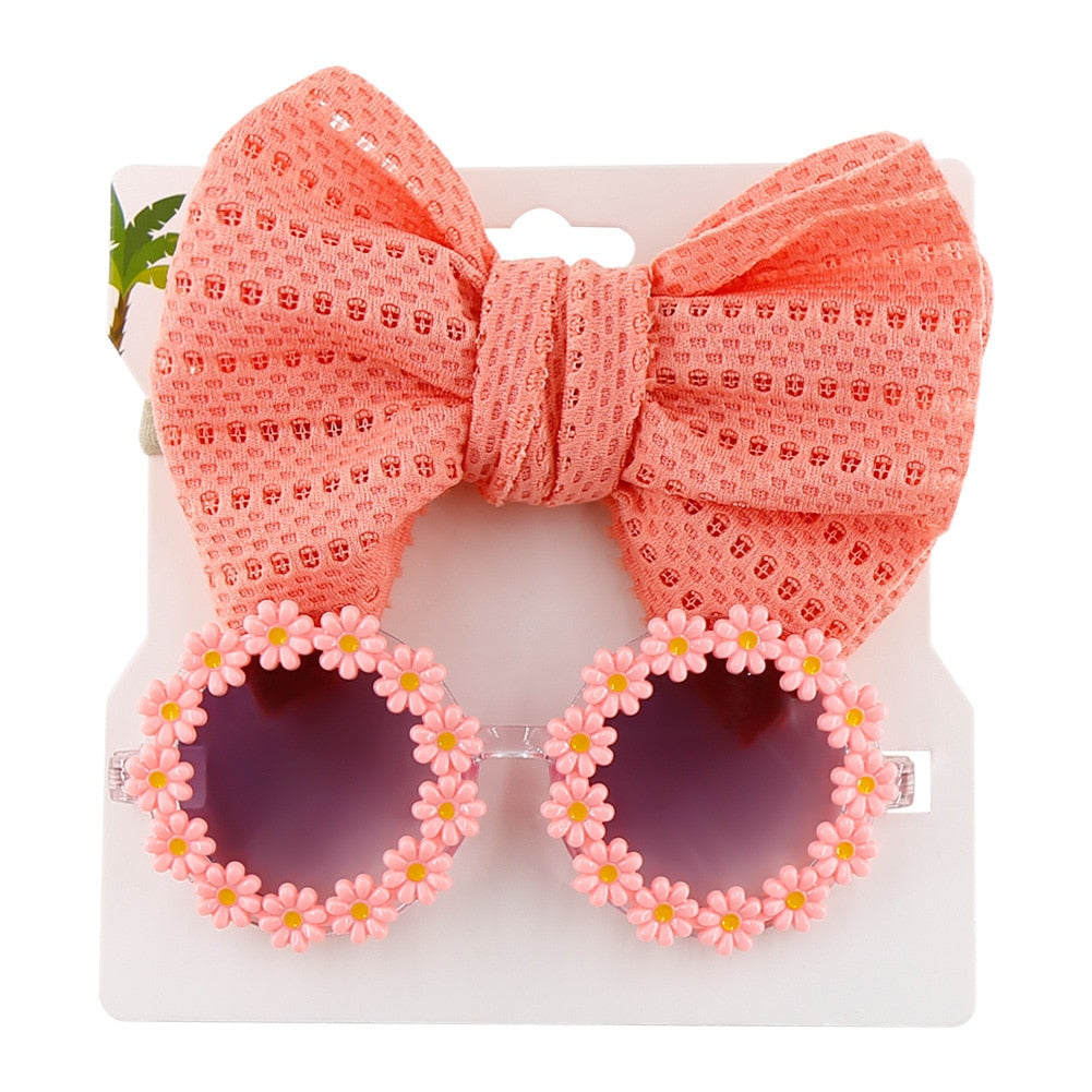 Stylish blue kids' UV protection sunglasses and bow headband set for active toddlers.