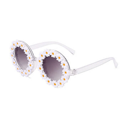 Fashionable green kids' sunglasses and coordinating bow headband, perfect for sun protection.