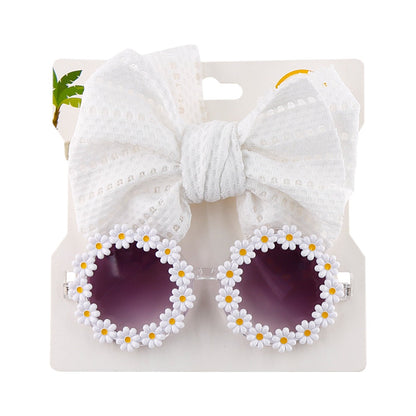 Vibrant orange children's eyewear set: UV protection sunglasses and a cute bow headband.