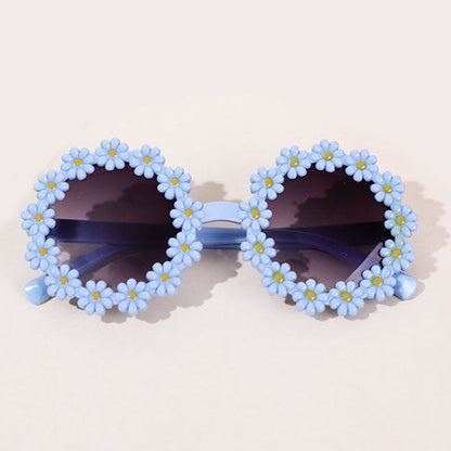 Close-up of a pink bow headband paired with trendy kids' UV protection sunglasses.