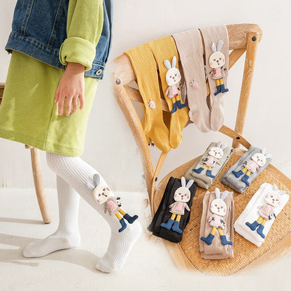 Durable pink knitted girls' pantyhose enhanced with a charming white cartoon rabbit, easy to wear kids' legwear.