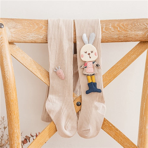 Soft cotton knitted pantyhose for girls in pink, adorned with a delightful cartoon rabbit, children's legwear.