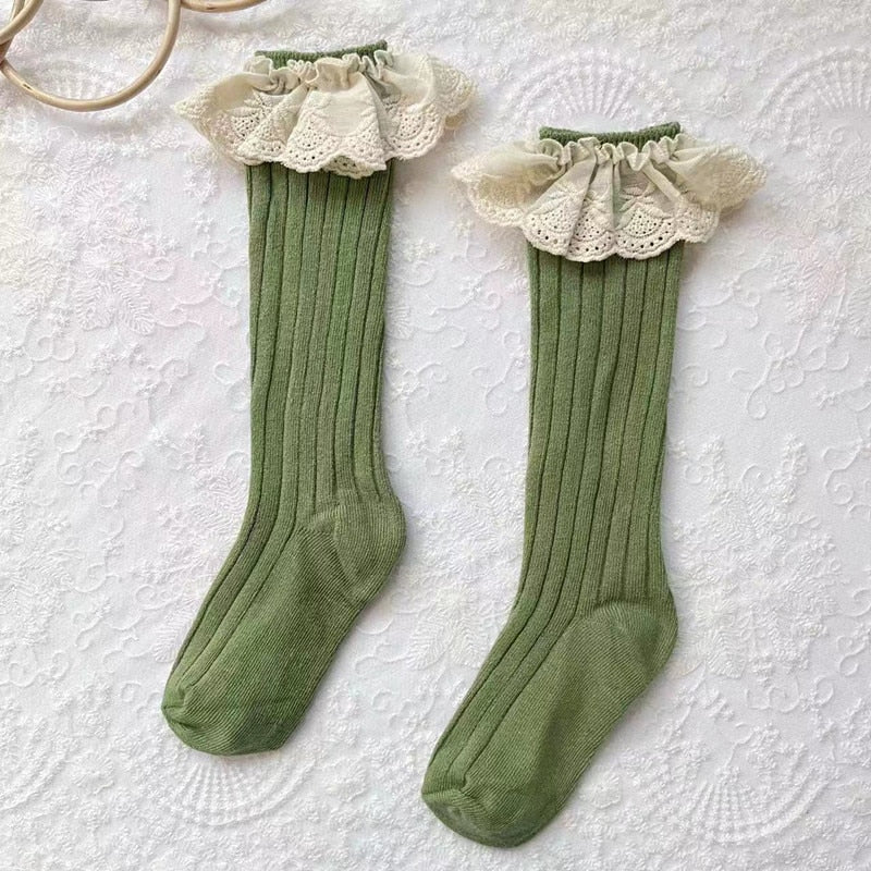 Infant fashion: blue cotton socks for girls with decorative lace trim and flower detail