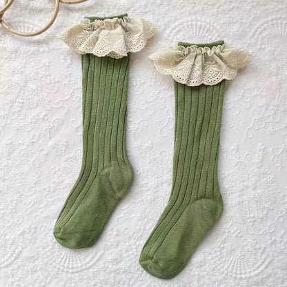Infant fashion: blue cotton socks for girls with decorative lace trim and flower detail