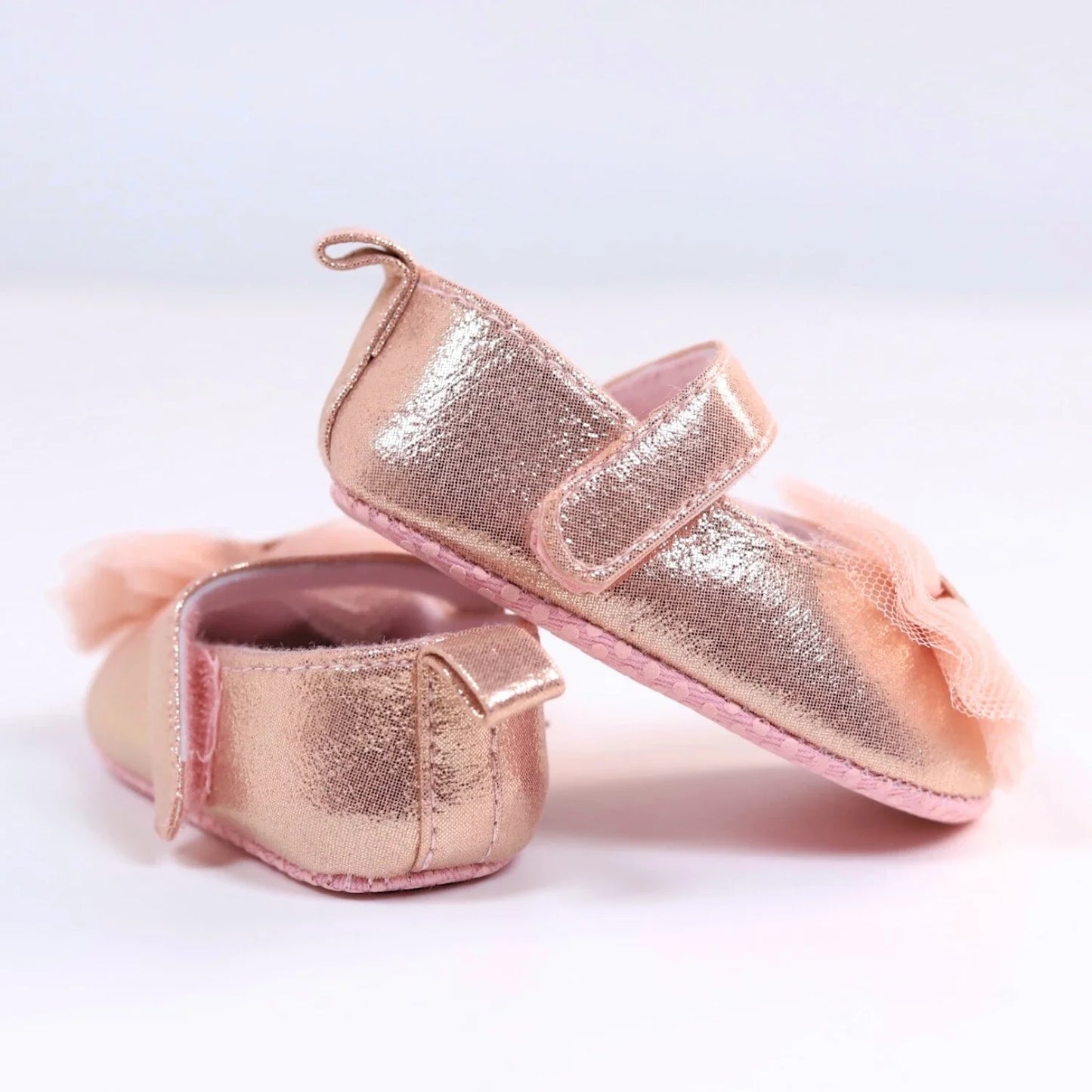 First steps pink princess shoes for baby girls, featuring delicate lace and convenient hook and loop closure.