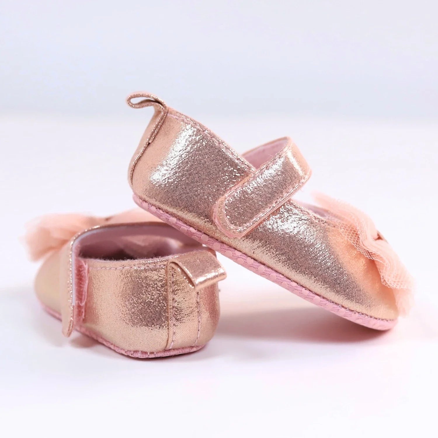 First steps pink princess shoes for baby girls, featuring delicate lace and convenient hook and loop closure.
