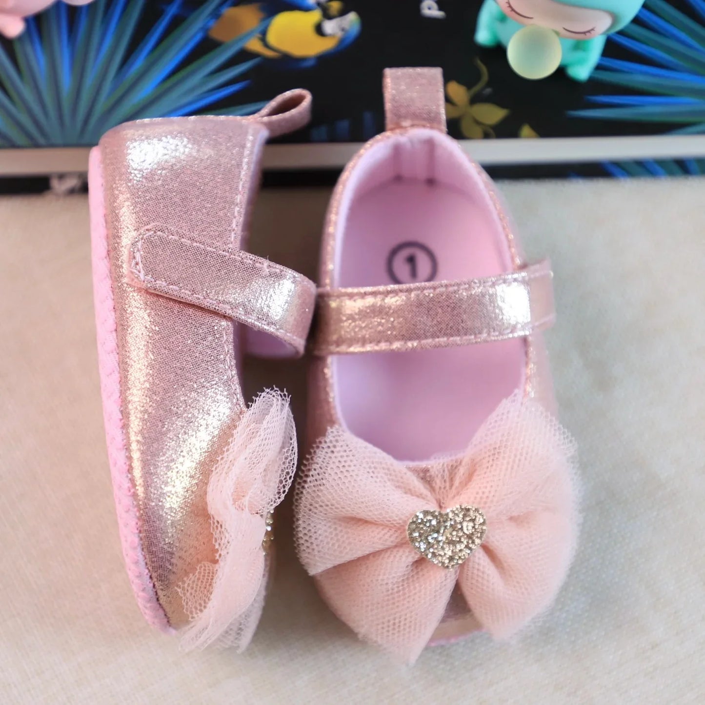 Breathable lace princess shoes for toddler girls, in soft pink with a stylish butterfly knot detail.